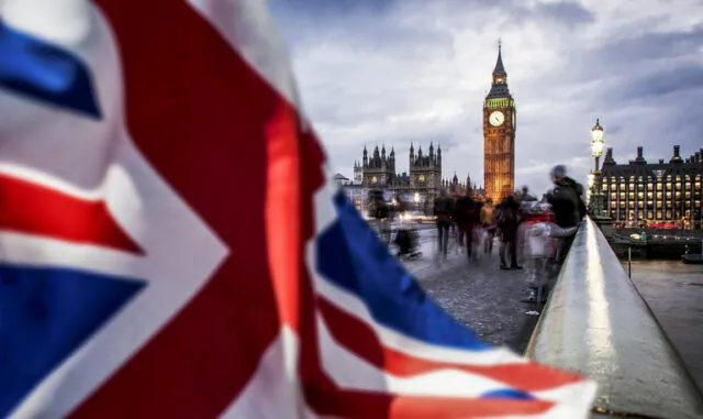 double exposure of flag and Westminster Palace with Big Ben